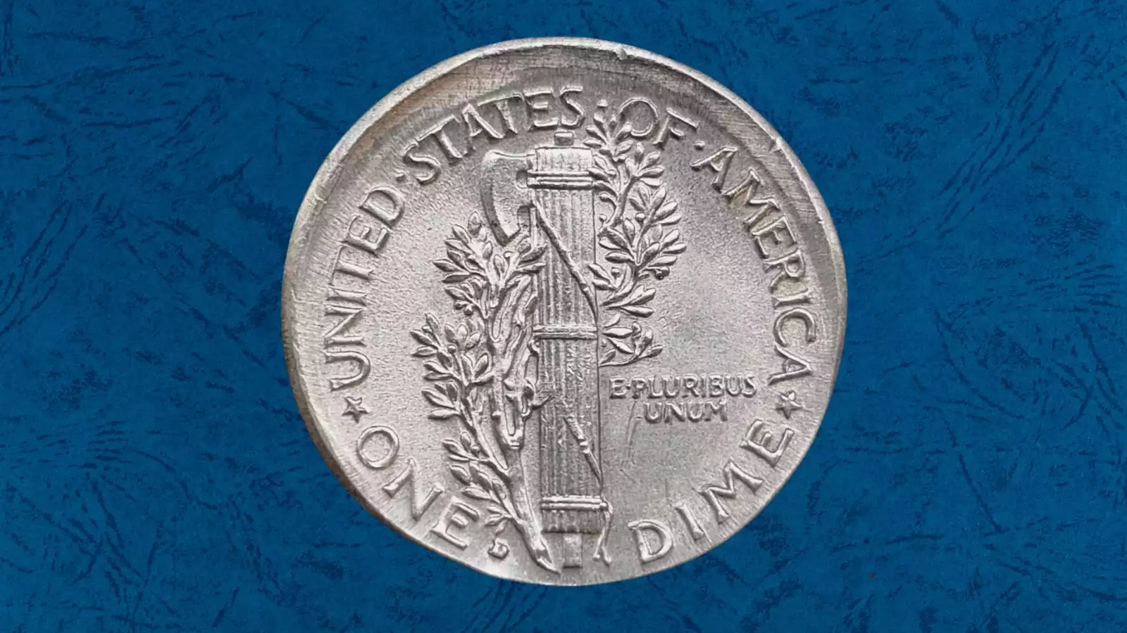 1937 Mercury dime off-center strike error showing design shifted to one side with blank planchet visible and date still readable